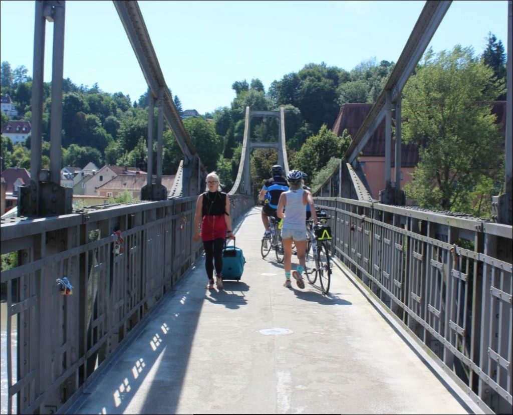 Crossing a pedestrian bridge on our final ride along the Danube
