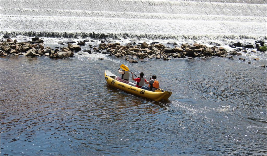 Kayakers playing in the waterworks in Old Cesky Krumlov