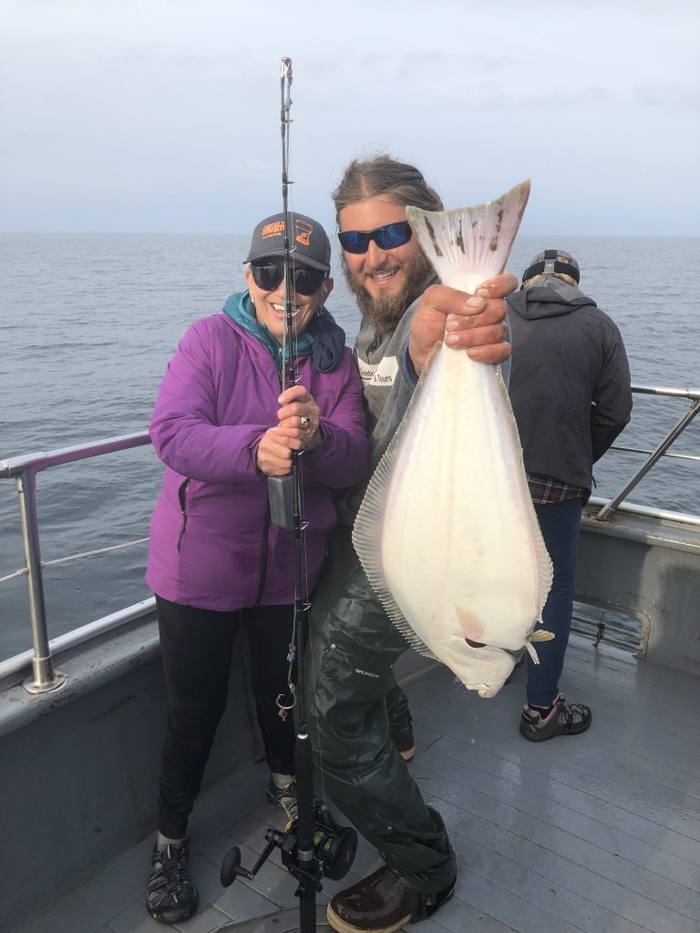 Eileen with her first Halibut catch in Homer AK