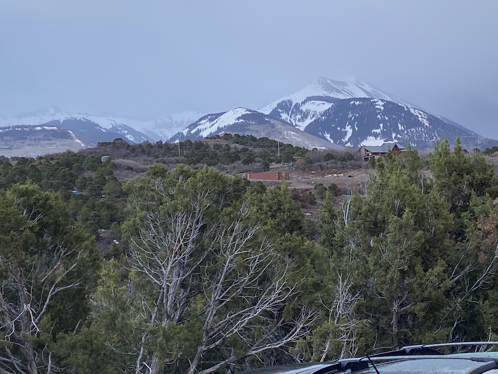 View of La Sal Mountains from the porch of Longbranch Cabin at Whispering Oaks Ranch near Moab UT